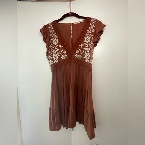 Clay brown dress with white flowers. Size small.